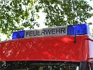 SCHRIFTZUG FEUERWEHR ZWISCHEN BLAULICHTER